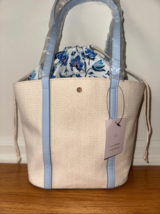 LC Lauren Conrad Handbags - LC Lauren Conrad Cream Tote with Light Blue Trim and Floral Drawstring